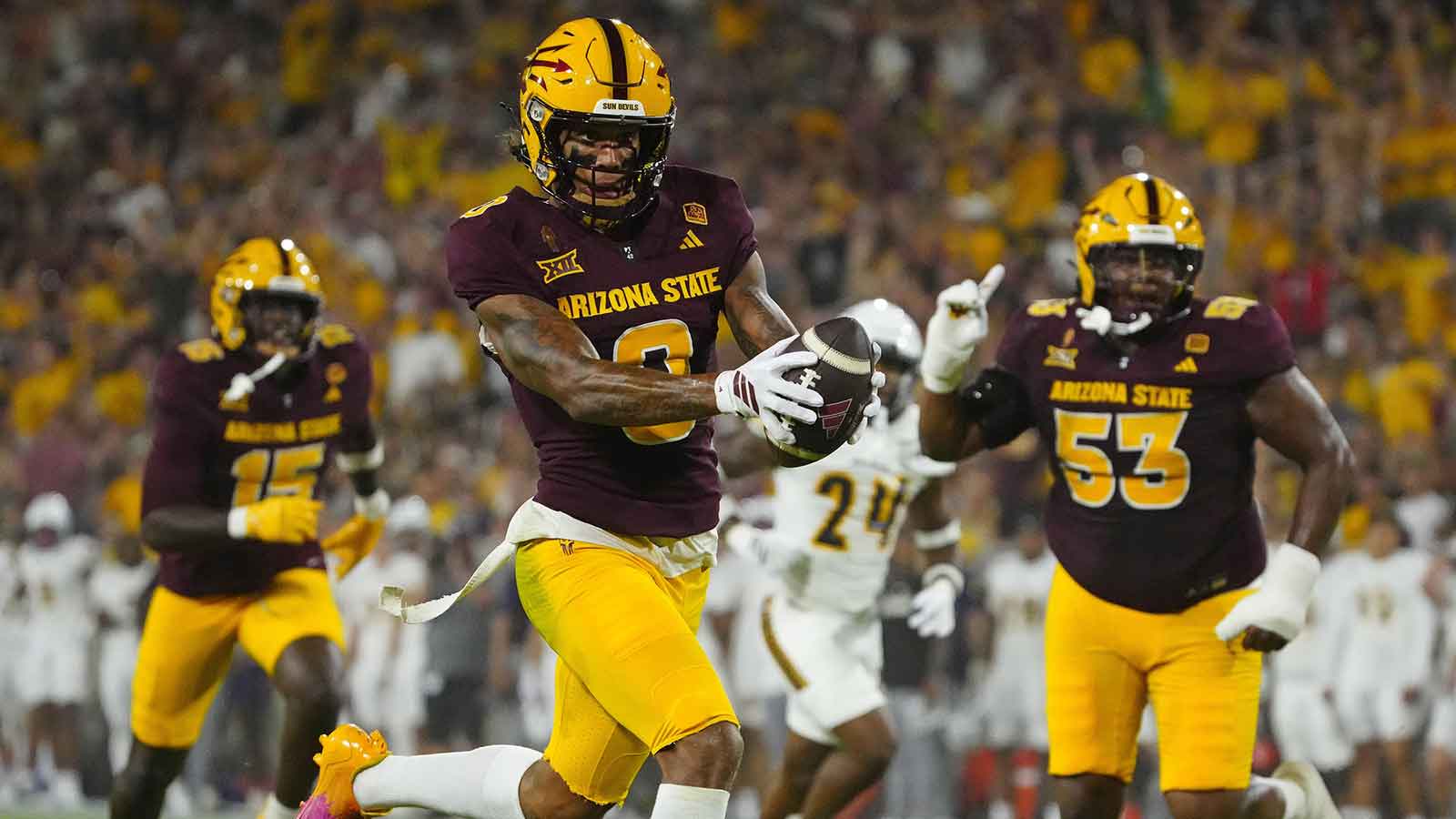 Arizona State wide receiver Jordyn Tyson (0) scores a touchdown against NAU during a game at Mountain America Stadium in Tempe on Aug. 30, 2025.