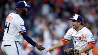 Houston Astros designated hitter Yordan Alvarez (44) and left fielder Jose Altuve (27) congratulate each other following the final out against the Los Angeles Angels during the ninth inning at Daikin Park.