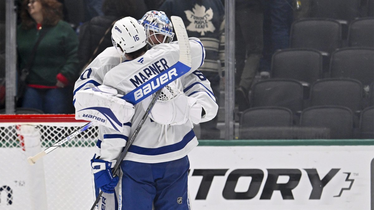 Toronto Maple Leafs right wing Mitch Marner (16) hugs goaltender Joseph Woll (60) after Toronto defeats the Dallas Stars at the American Airlines Center.