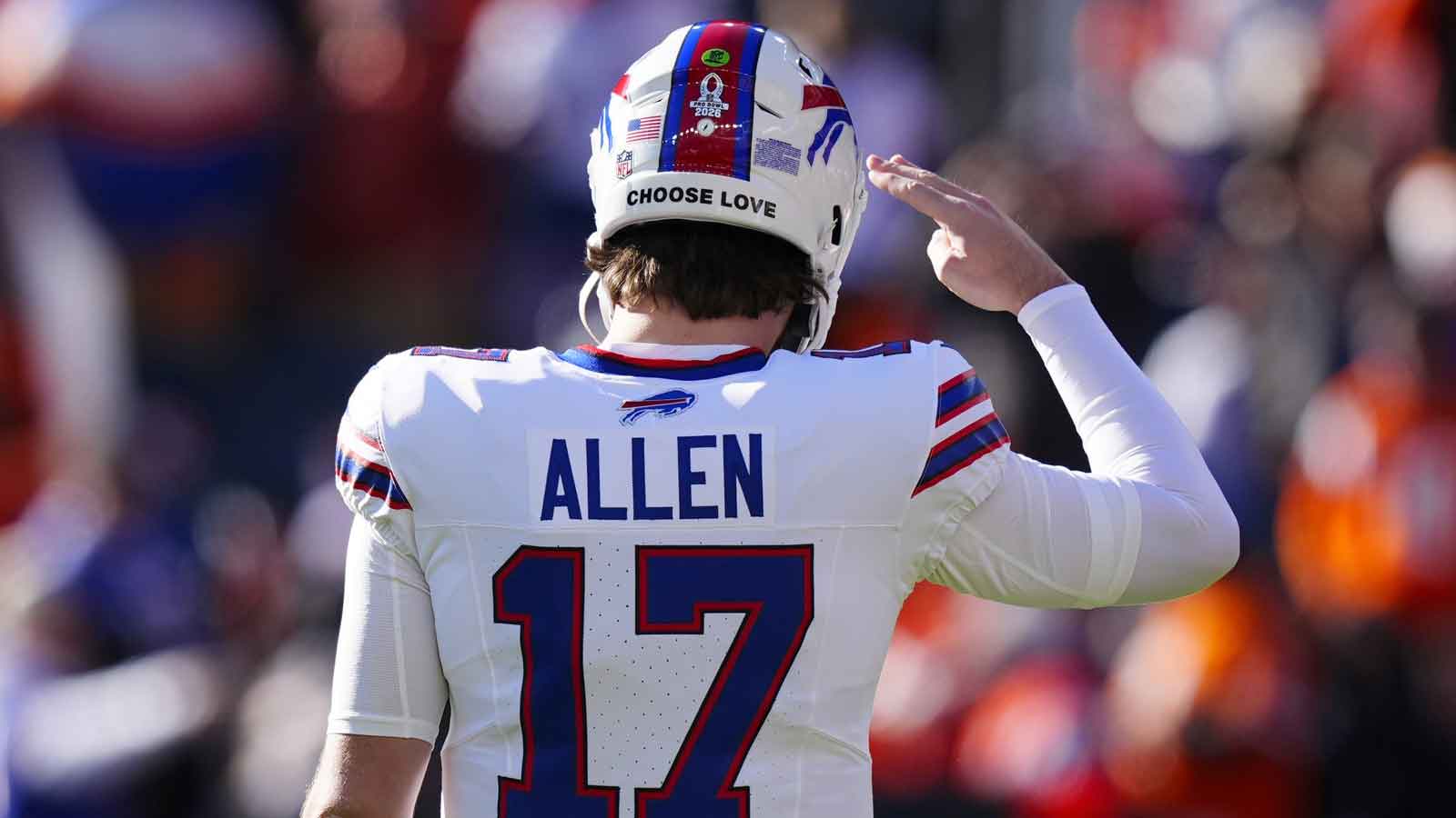 Buffalo Bills quarterback Josh Allen (17) salutes before an AFC Divisional Round playoff game against the Denver Broncos at Empower Field at Mile High.