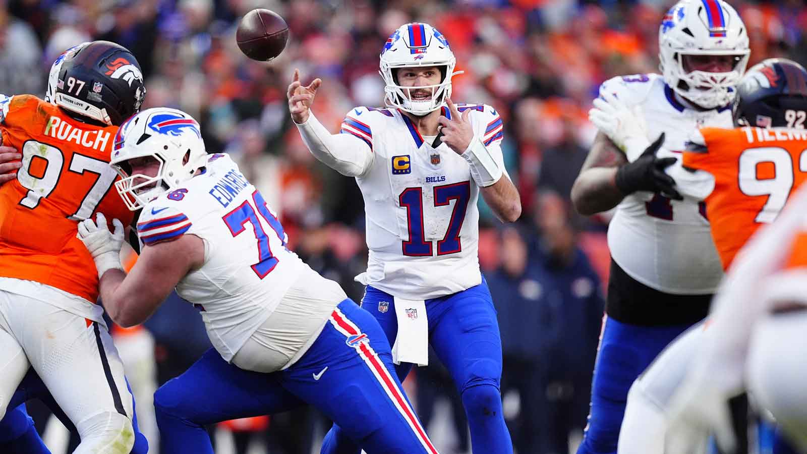 Buffalo Bills quarterback Josh Allen (17) throws a touchdown pass during the third quarter of an AFC Divisional Round playoff game against the Denver Broncos at Empower Field at Mile High.