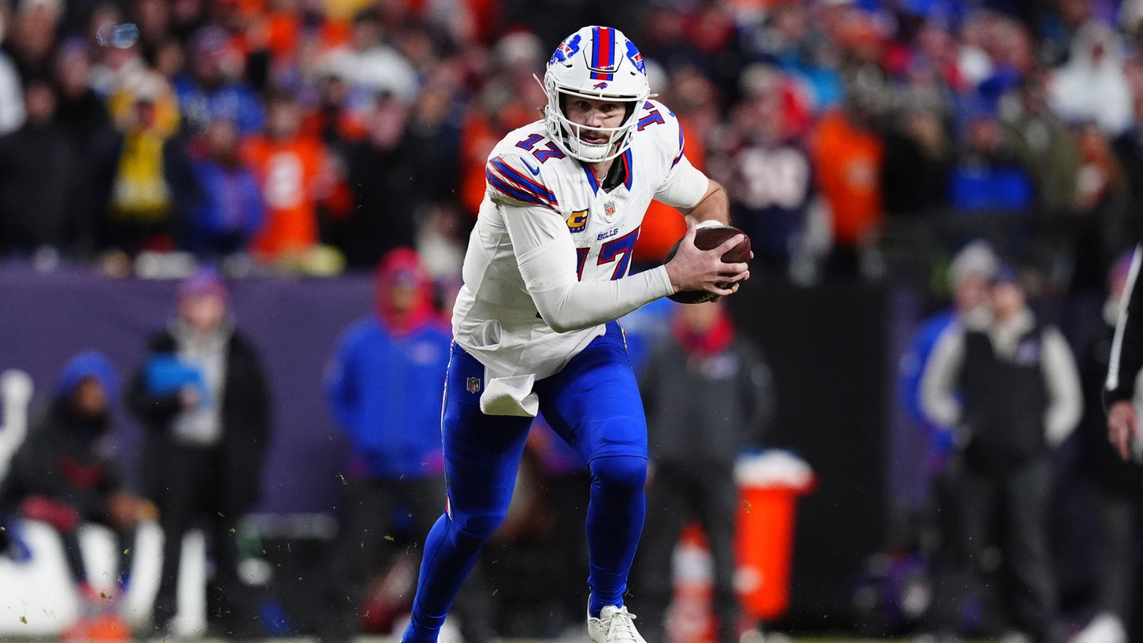 Buffalo Bills quarterback Josh Allen (17) runs during the fourth quarter of an AFC Divisional Round playoff game against the Denver Broncos at Empower Field at Mile High. 