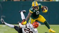 Green Bay Packers running back Josh Jacobs (8) stiff-arms Cincinnati Bengals cornerback Cam Taylor-Britt (29) on Sunday, October 12, 2025, at Lambeau Field in Green Bay, Wis. The Packers won the game, 27-18.
