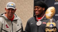 Ole Miss quarterbacks coach Joe Judge and defensive lineman Will Echoles pose for photos during the CFP and Fiesta Bowl Media Day at the JW Marriott Scottsdale Camelback Inn Resort & Spa, in Scottsdale, Ariz., on Tuesday, Jan. 6, 2026.
