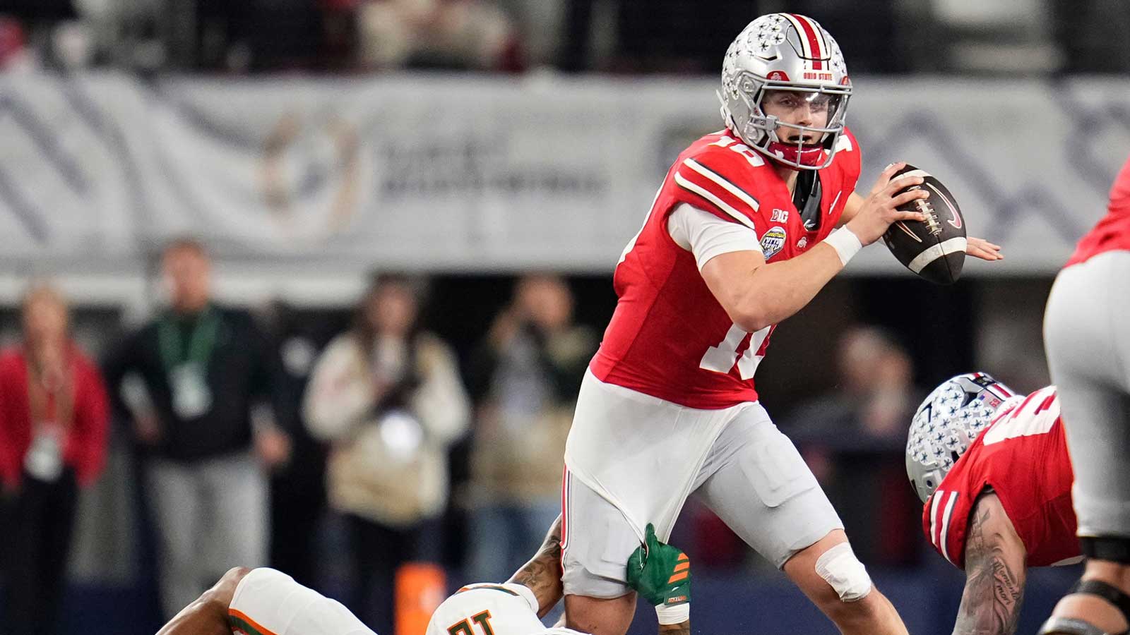 Miami Hurricanes defensive lineman Marquise Lightfoot (12) sacks Ohio State Buckeyes quarterback Julian Sayin (10) during the Cotton Bowl at AT&T Stadium in Arlington, Texas for the College Football Playoff quarterfinal game on Dec. 31, 2025. Ohio State lost 24-14.