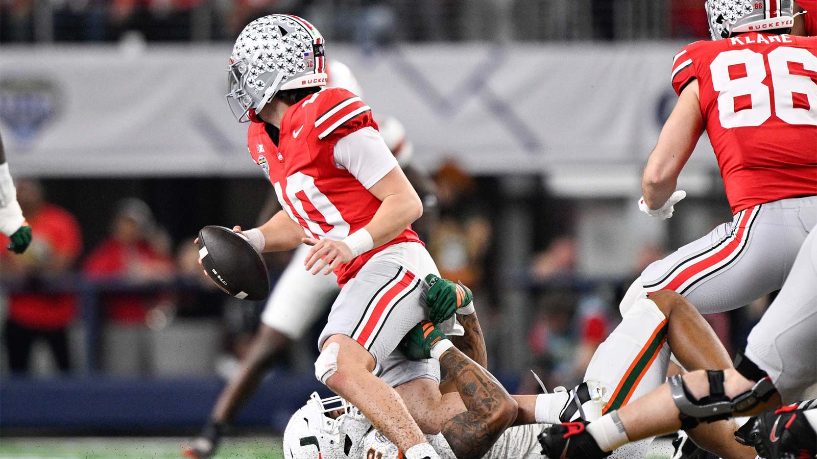 Ohio State Buckeyes quarterback Julian Sayin (10) is sacked by Miami Hurricanes wide receiver Ny Carr (12) in the third quarter during the 2025 Cotton Bowl and quarterfinal game of the College Football Playoff at AT&T Stadium.