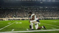 Michigan running back Justice Haynes prays before kickoff against Michigan State at Spartan Stadium in East Lansing on Saturday, October 25, 2025.