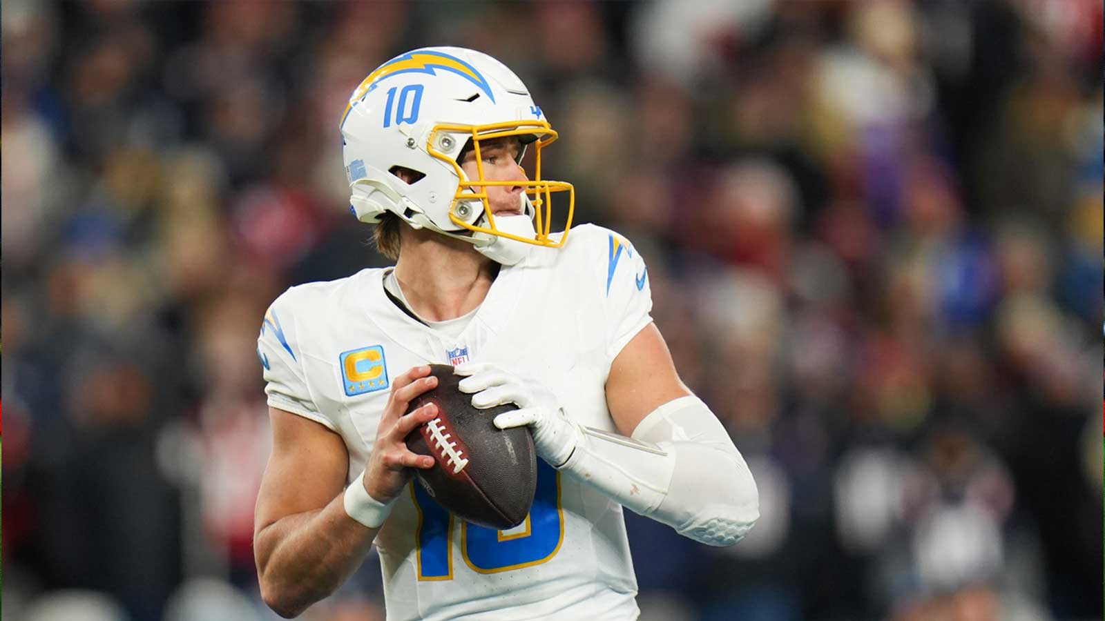 Los Angeles Chargers quarterback Justin Herbert (10) looks to pass during the third quarter against the New England Patriots in an AFC Wild Card Round game at Gillette Stadium. 