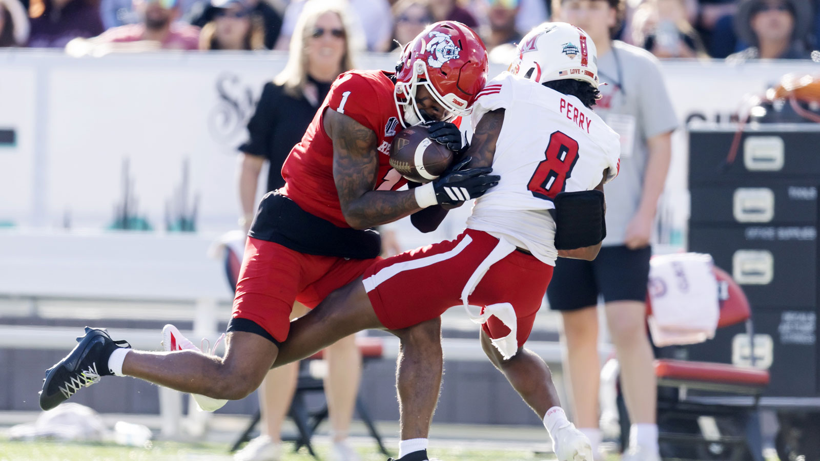 Fresno State Bulldogs defensive back Jakari Embry (1) intercepts the ball against Miami (OH) RedHawks wide receiver Kam Perry (8) during the Snoop Dogg Arizona Bowl at Casino Del Sol Stadium.
