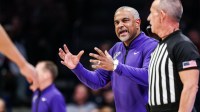 Kansas State Wildcats head coach Jerome Tang yells out to teammates during the first half of the game against the Arizona Wildcats at McKale Memorial Center.