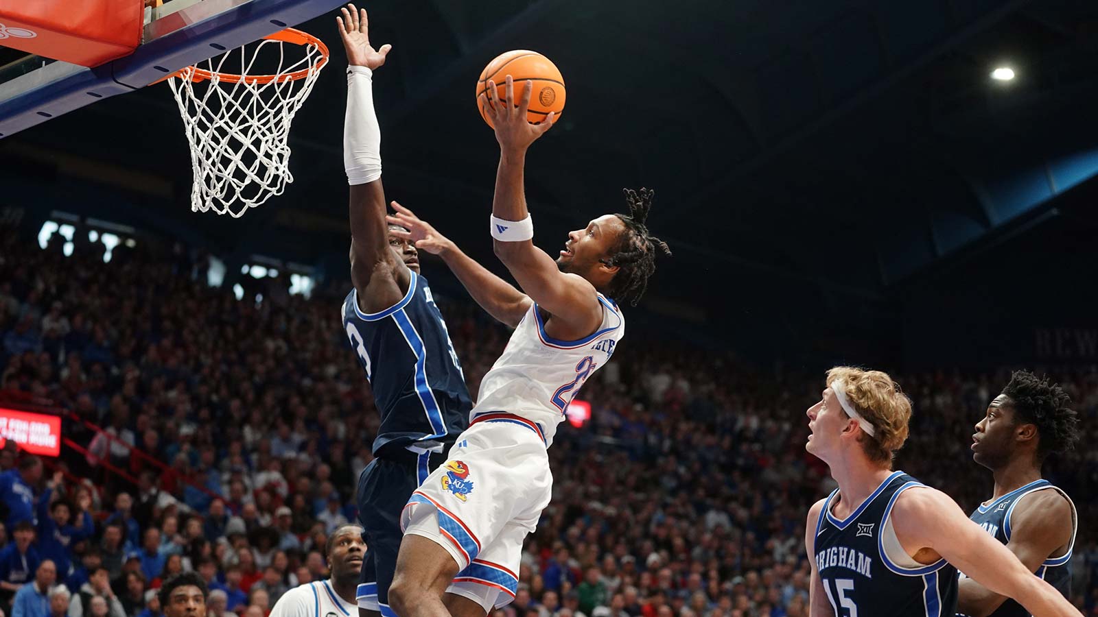Kansas Jayhawks guard Darryn Peterson (22) shoots a layup against BYU Cougars during the game inside Allen Fieldhouse.