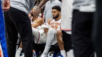 New York Knicks center/forward Karl-Anthony Towns (32) looks on from the bench against the New Orleans Pelicans during the second half at Smoothie King Center.