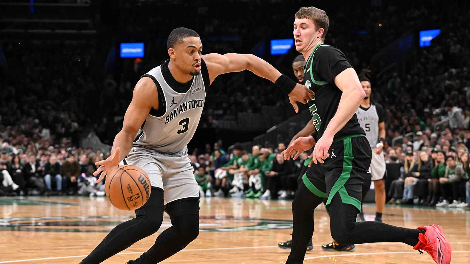 San Antonio Spurs forward Keldon Johnson (3) drives to the basket against against the Boston Celtics during the first half at the TD Garden.