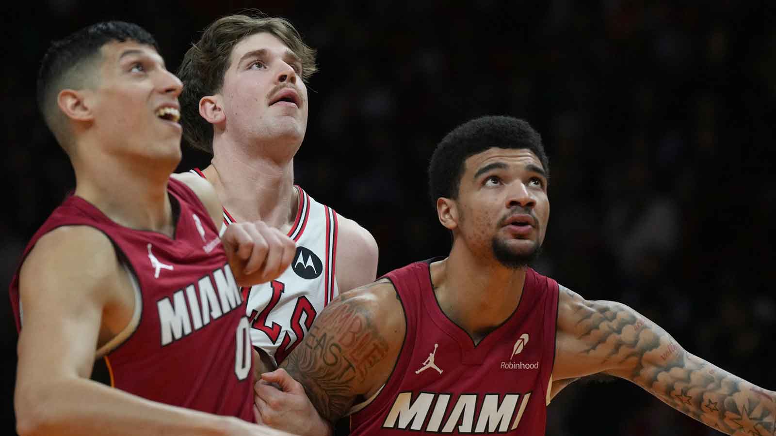 Chicago Bulls center Lachlan Olbrich (47) battles for a rebound against Miami Heat forward Simone Fontecchio (0) and center Kel'el Ware (7) during the first half at Kaseya Center.