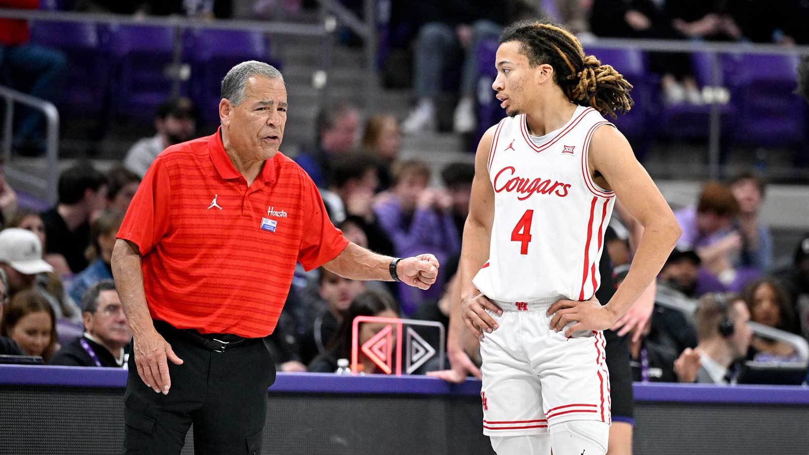 Houston Cougars head coach Kelvin Sampson talks with guard Kingston Flemings (4) during the second half against the TCU Horned Frogs at Ed and Rae Schollmaier Arena.