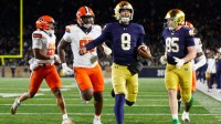 Notre Dame quarterback Kenny Minchey (8) runs the ball into the end zone for a touchdown in the second half of a NCAA football game against Syracuse at Notre Dame Stadium on Saturday, Nov. 22, 2025, in South Bend.