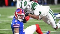 New York Jets safety Keidron Smith (46) tackles Buffalo Bills wide receiver Keon Coleman (0) during the third quarter at Highmark Stadium.