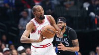 Houston Rockets forward Kevin Durant (7) passes the ball past Dallas Mavericks forward Anthony Davis (3) during the first quarter at American Airlines Center.
