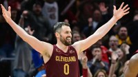 Cleveland Cavaliers forward Kevin Love (0) celebrates after guard Donovan Mitchell (not pictured) hit a three point basket during overtime against the Chicago Bulls at Rocket Mortgage FieldHouse.
