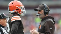 Cleveland Browns head coach Kevin Stefanski speaks with quarterback Shedeur Sanders (12) during a time out in the second quarter against the Pittsburgh Steelers at Huntington Bank Field.