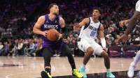 Sacramento Kings guard Zach LaVine (8) holds onto the ball next to Dallas Mavericks guard Max Christie (00) in the fourth quarter at the Golden 1 Center.