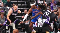 Kings guard Keon Ellis and Zach LaVine defend