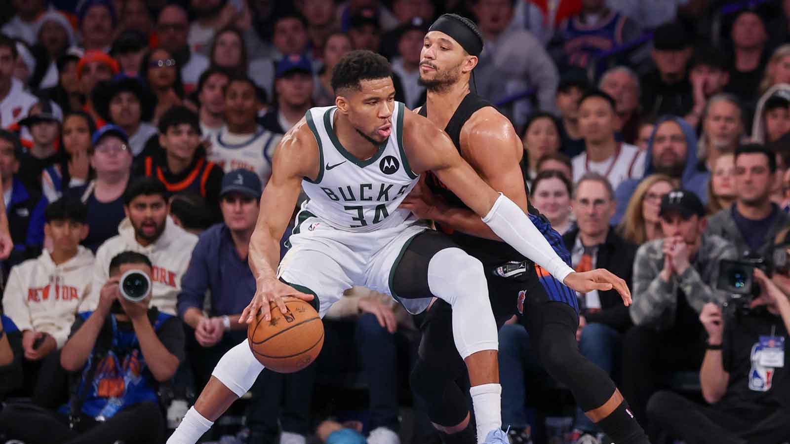 Bucks forward Giannis Antetokounmpo (34) dribbles as New York Knicks guard Josh Hart (3) defends during the second half at Madison Square Garden