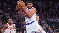 Knicks center Karl-Anthony Towns (32) rebounds