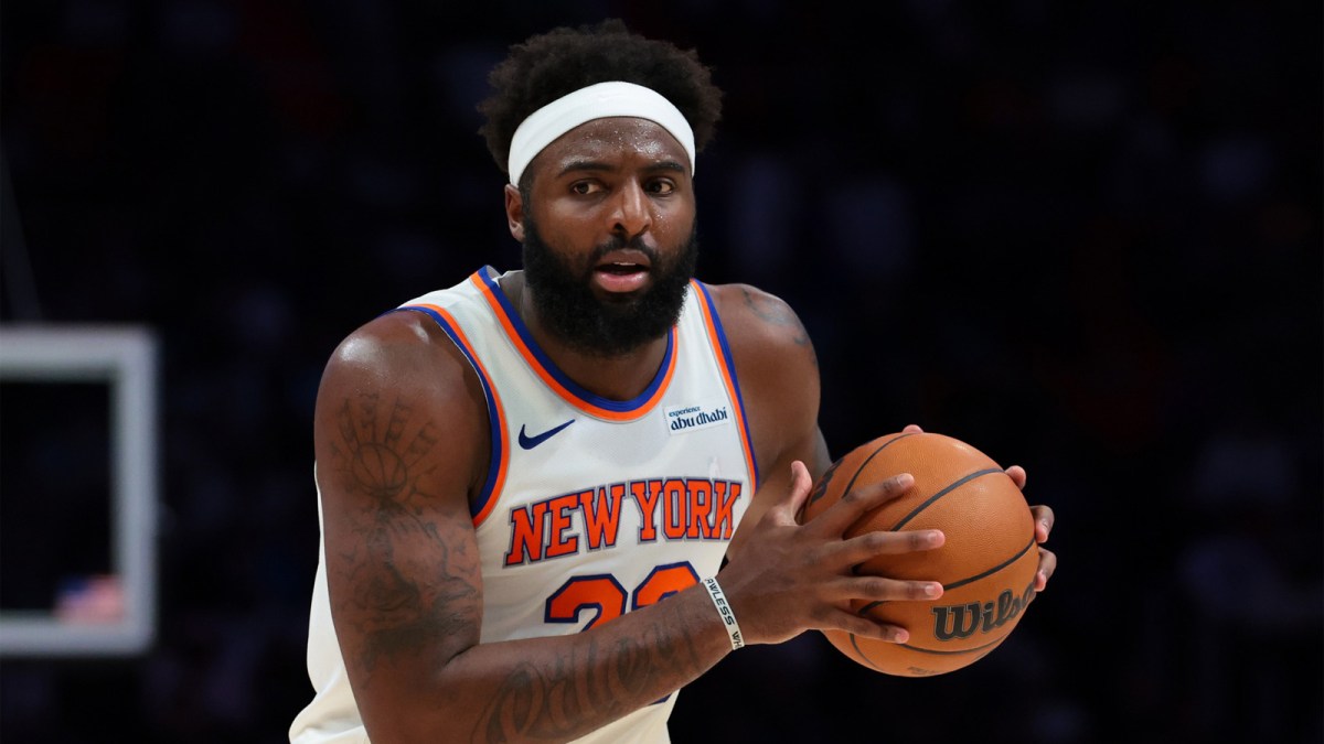New York Knicks center Mitchell Robinson (23) protects the basketball against the Miami Heat during the third quarter at Kaseya Center.