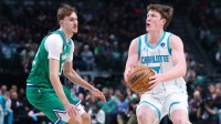 Charlotte Hornets guard Kon Knueppel (7) shoots as Dallas Mavericks forward Cooper Flagg (32) defends during the first quarter at American Airlines Center.