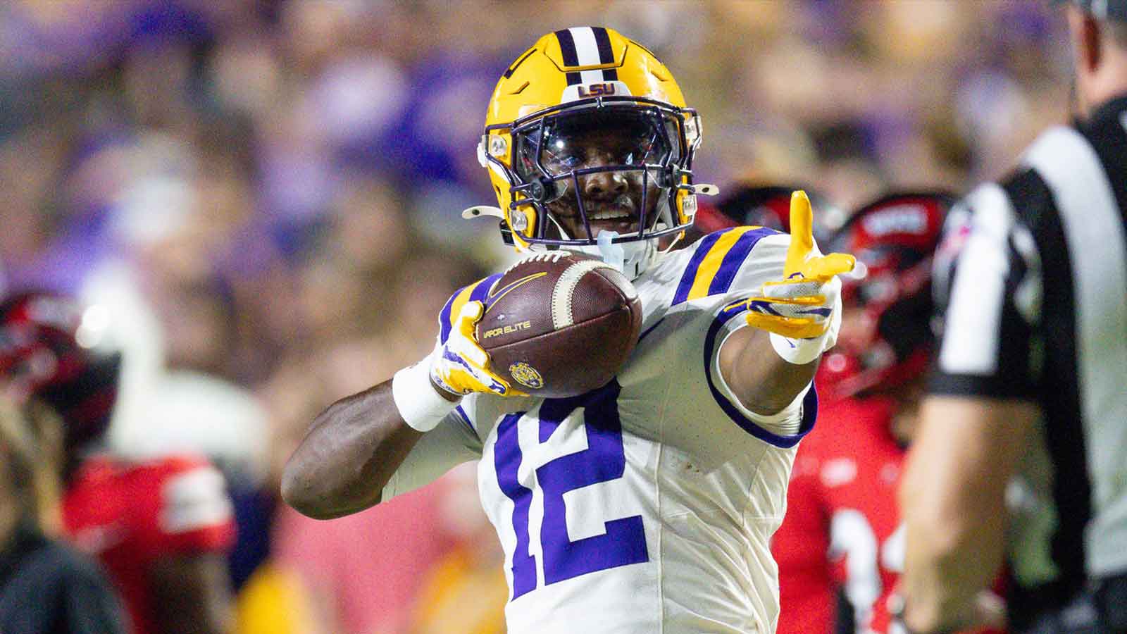 LSU Tigers wide receiver Kyle Parker (12) reacts to making a first down against Western Kentucky Hilltoppers defensive back Nazir Ward (not pictured) during the first half at Tiger Stadium. 