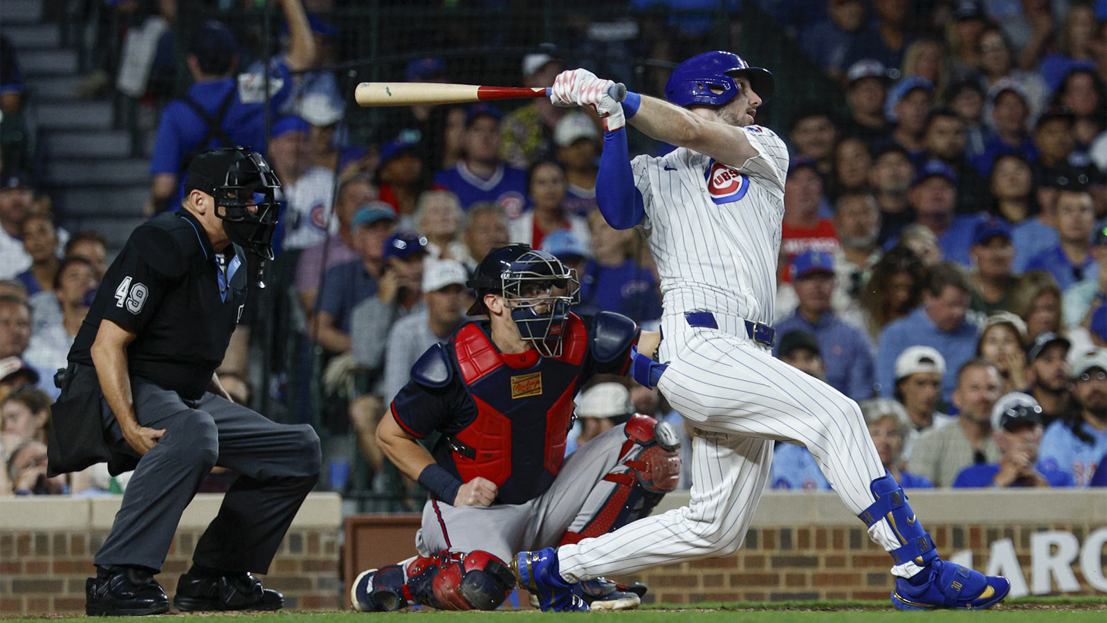 Chicago Cubs right fielder Kyle Tucker (30) hits a three-run home run against the Atlanta Braves during the third inning at Wrigley Field