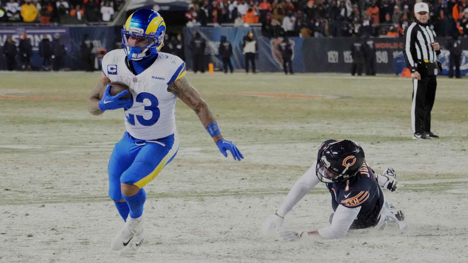 Los Angeles Rams running back Kyren Williams (23) runs for a five-yard touchdown against Chicago Bears safety C.J. Gardner-Johnson (35) during the fourth quarter of an NFC Divisional Round game at Soldier Field. Mandatory Credit: David Banks-Imagn Images