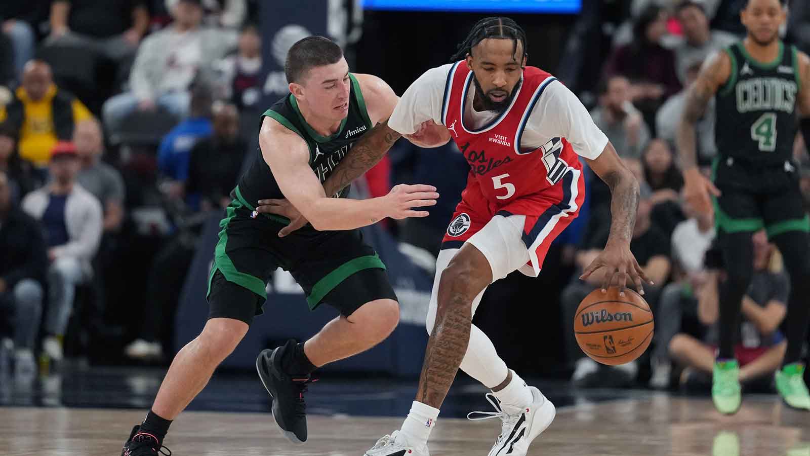 https://wp.clutchpoints.com/wp-content/uploads/2026/01/LA-Clippers-forward-Derrick-Jones-Jr.-5-is-defended-by-Boston-Celtics-guard-Payton-Pritchard-11.jpg