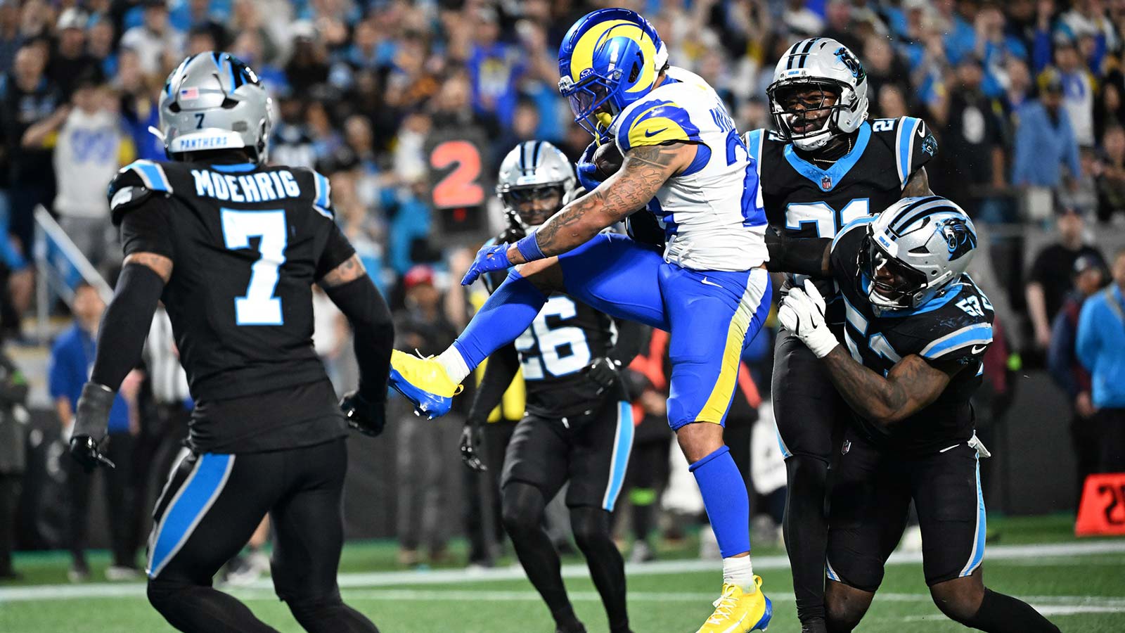 Los Angeles Rams running back Kyren Williams (23) rushes for a touchdown against the Carolina Panthers in the second half during the NFC Wild Card Round game at Bank of America Stadium.