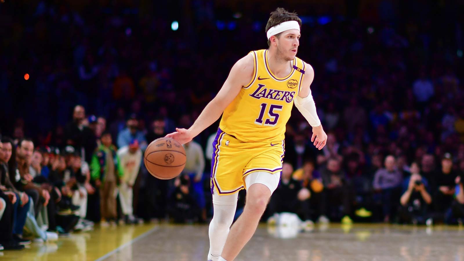 Lakers guard Austin Reaves (15) moves the ball against the New York Knicks during the second half at Crypto.com Arena