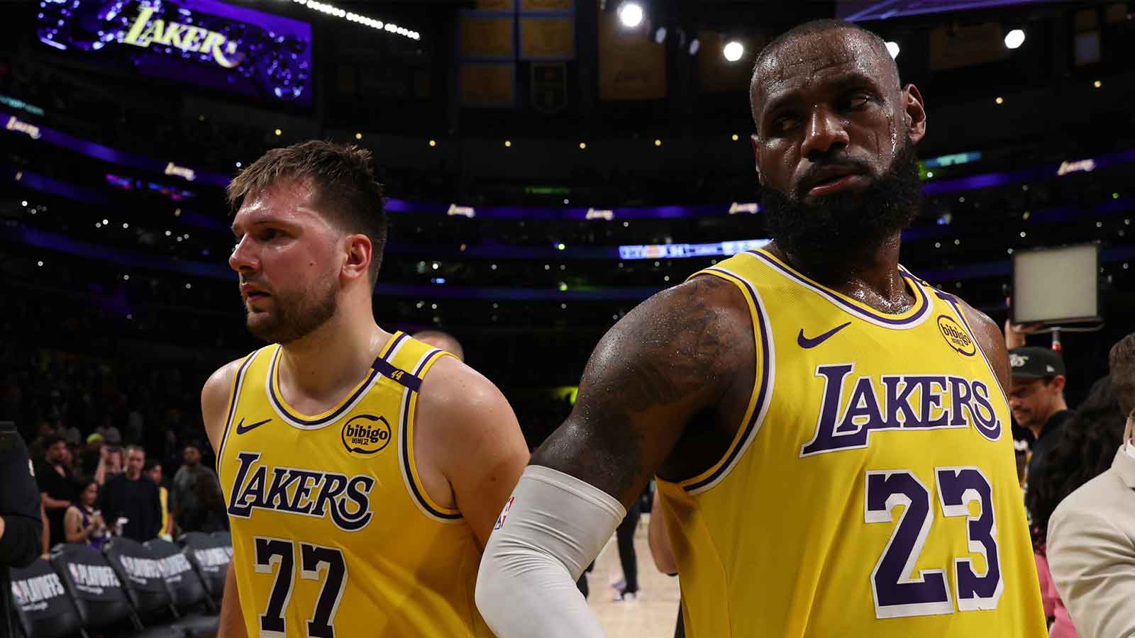 Lakers guard Luka Doncic (77) and Los Angeles Lakers forward LeBron James (23) leave a court after defeating the Minnesota Timberwolves 94-85 in game two of first round for the 2024 NBA Playoffs at Crypto.com Arena