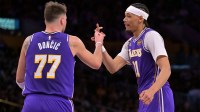 Los Angeles Lakers guard Luka Doncic (77) and center Jaxson Hayes (11) on the court after a basket during the first half against the San Antonio Spurs at Crypto.com Arena.
