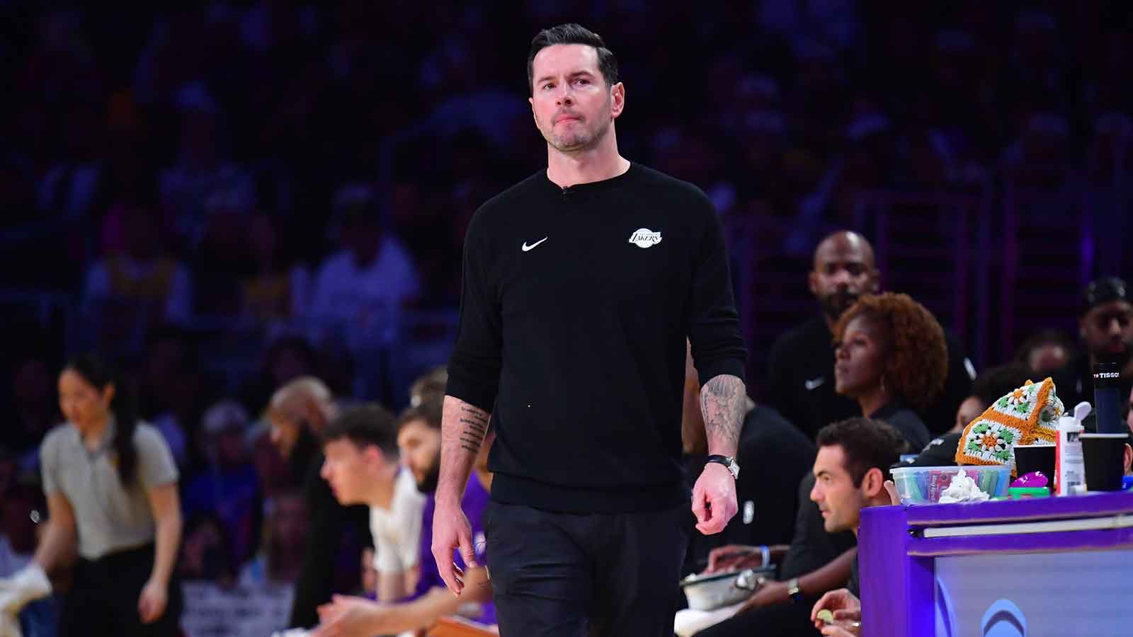 Lakers head coach JJ Redick watches game action against the Houston Rockets during the first half at Crypto.com Arena