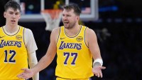 Lakers forward Jake LaRavia (12) and guard Luka Doncic (77)