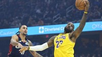 Los Angeles Lakers forward LeBron James (23) catches a pass beside Cleveland Cavaliers guard Jaylon Tyson (20) in the first quarter at Rocket Arena.