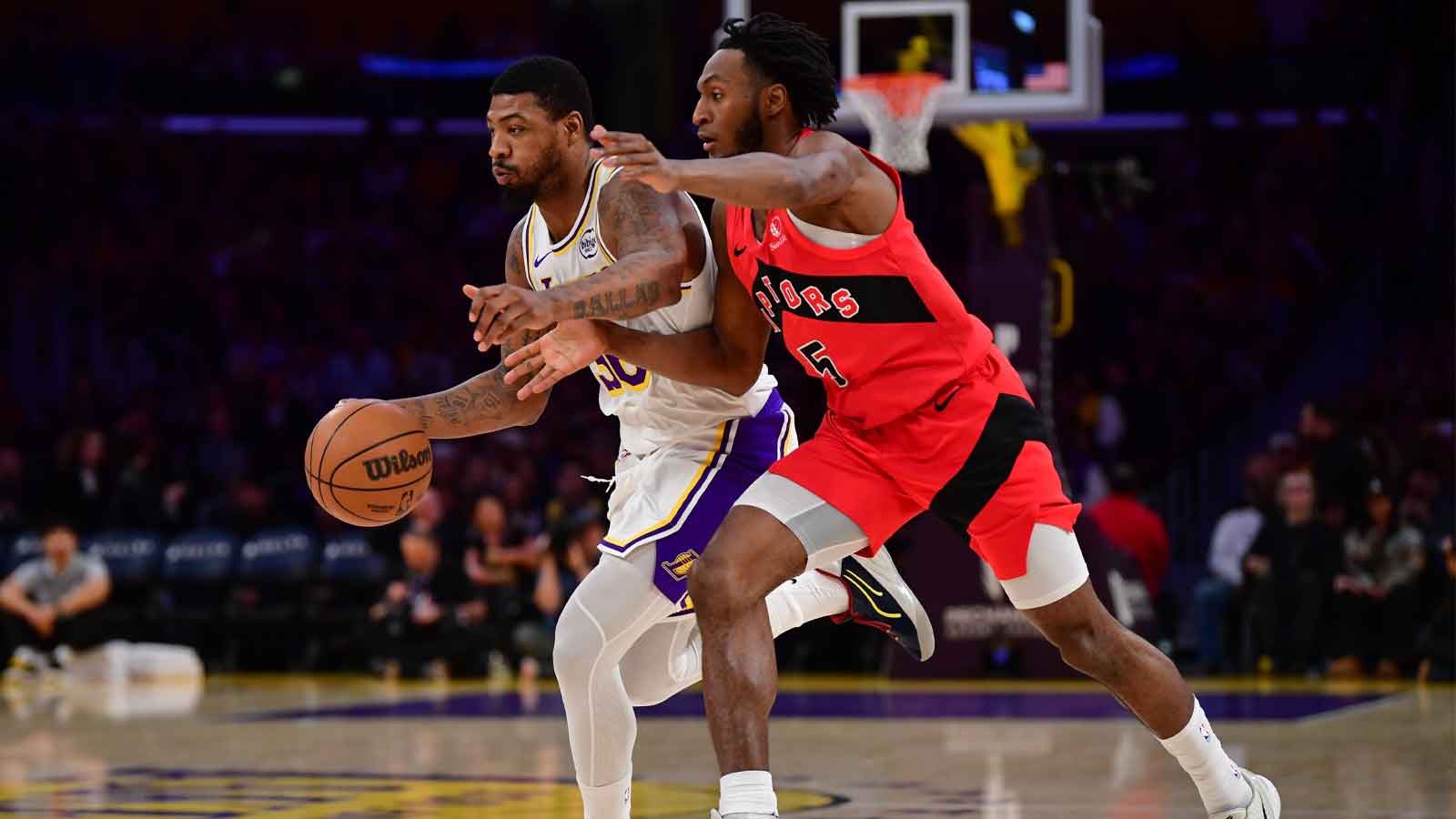 Los Angeles Lakers guard Marcus Smart (36) moves the ball against Toronto Raptors guard Immanuel Quickley (5) during the first half at Crypto.com Arena.