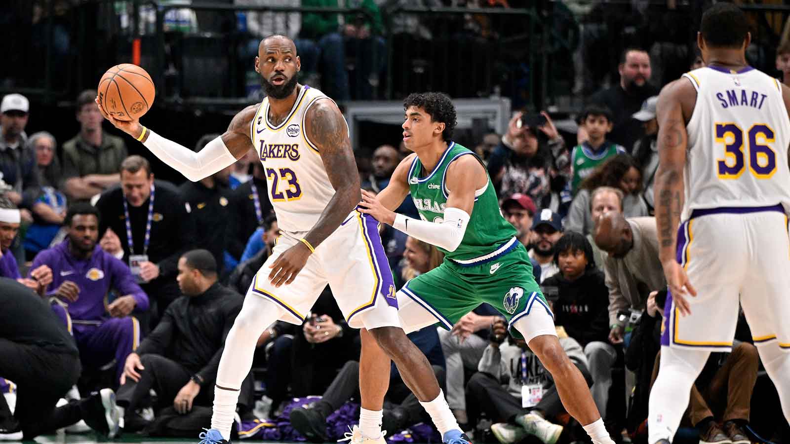 Los Angeles Lakers forward LeBron James (23) looks to move the ball past Dallas Mavericks guard Max Christie (00) during the first quarter at the American Airlines Center.