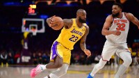 Los Angeles Lakers forward LeBron James (23) moves to the basket against New York Knicks center Karl-Anthony Towns (32) during the second half at Crypto.com Arena.