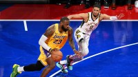 Los Angeles Lakers forward LeBron James (23) dribbles against Indiana Pacers guard Tyrese Haliburton (0) during the fourth quarter of the NBA In-Season Tournament Championship game at T-Mobile Arena. Mandatory Credit: Candice Ward-Imagn Images