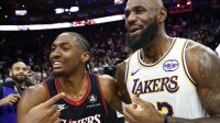 Los Angeles Lakers forward LeBron James (23) and Philadelphia 76ers guard Tyrese Maxey after the game at Xfinity Mobile Arena.