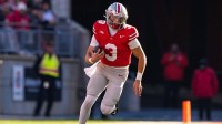 Ohio State Buckeyes quarterback Lincoln Kienholz (3) runs the ball in the second half of the NCAA football game at Ohio Stadium
