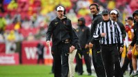 Southern California Trojans head coach Lincoln Riley watches game action against the Iowa Hawkeyes during the first half at the Los Angeles Memorial Coliseum.