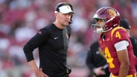 Southern California Trojans head coach Lincoln Riley talks with Southern California Trojans quarterback Husan Longstreet (4) in the second half against the Missouri State Bears at United Airlines Field at Los Angeles Memorial Coliseum. Mandatory Credit: Kirby Lee-Imagn Images