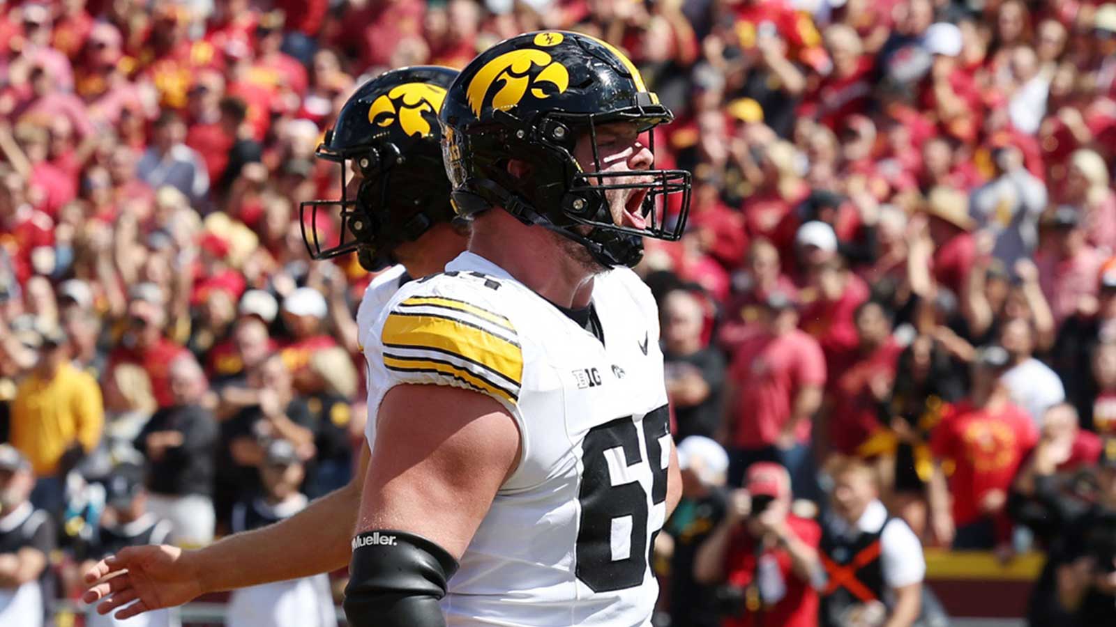 ; Iowa Hawkeyes offensive lineman Logan Jones (65) reacts after a play against the Iowa State Cyclones during the second half at Jack Trice Stadium. 